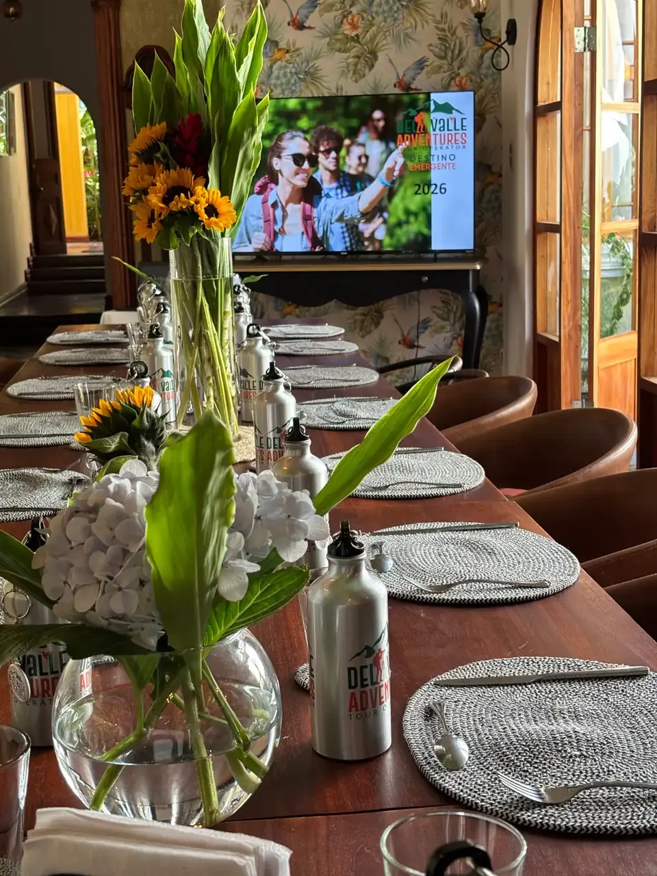 Long table set with flowers in the dining room