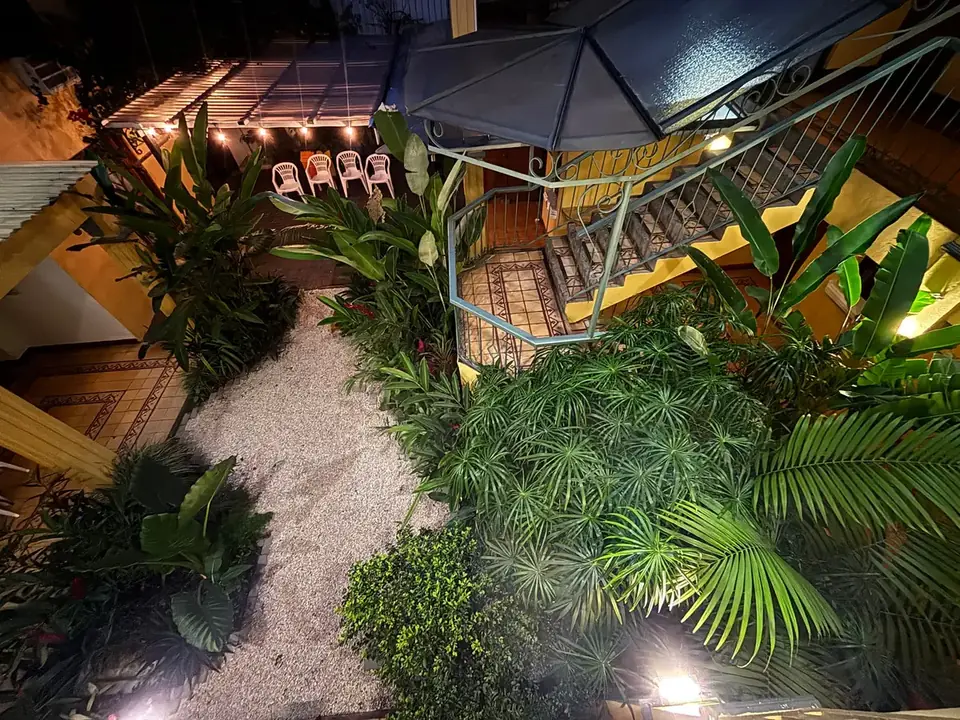 The garden courtyard lit at night